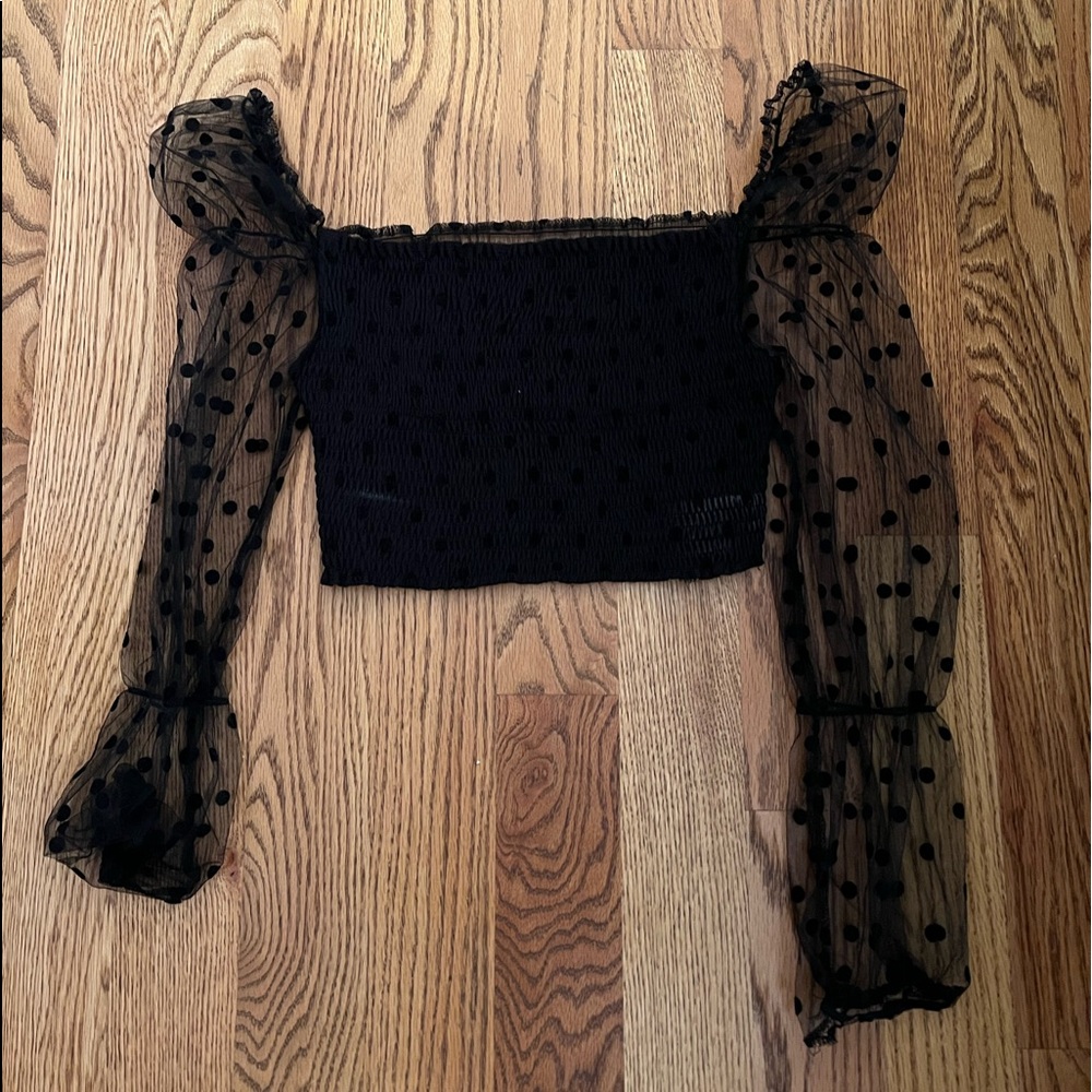 Black long sleeve crop top. See thru back. Size medium.